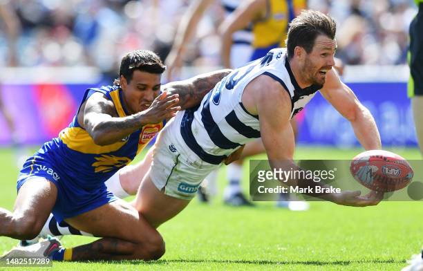 Patrick Dangerfield of the Cats tackled by Tim Kelly of the Eagles during the round five AFL match between Geelong Cats and West Coast Eagles at...