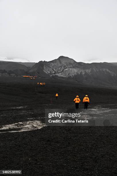 trekking up a black volcano in antarctica - deception island stock pictures, royalty-free photos & images