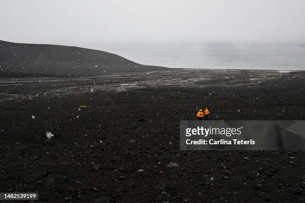 hikers from a cruise ship on a volcano in antarctica - deception island stock pictures, royalty-free photos & images