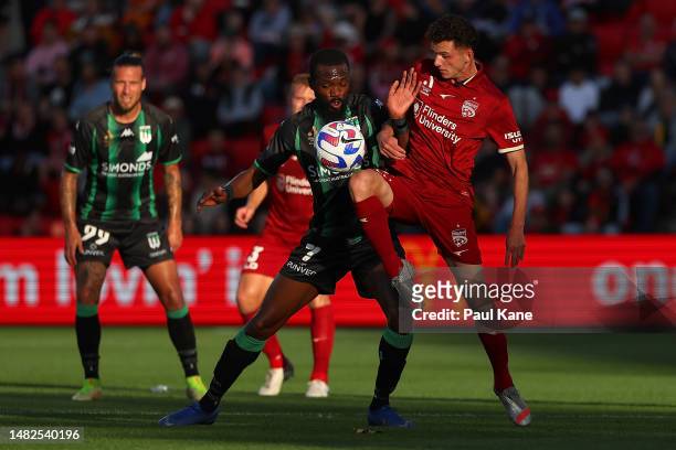 Tongo Doumbia of Western United and Louis D'Arrigo of Adelaide contest for the ball during the round 24 A-League Men's match between Adelaide United...