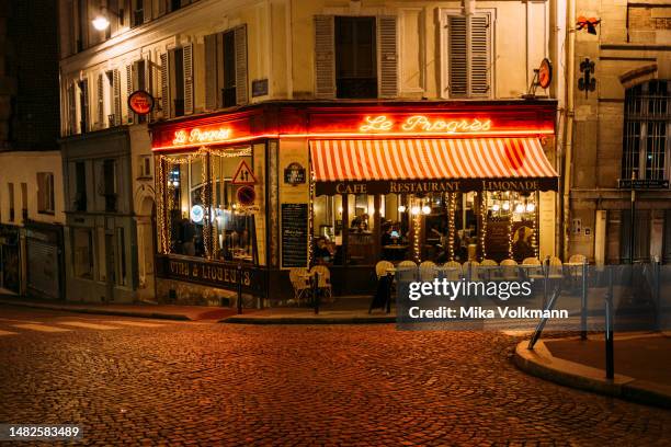 Café, Restaurant in Montmartre, 2023 in Paris, France.Famous for its iconic landmarks, Paris is considered one of the most beautiful and romantic...