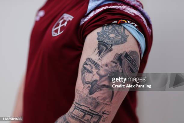 Detailed view of tattoos on a West Ham United fan featuring Bobby Moore and Upton Park prior to the Premier League match between West Ham United and...
