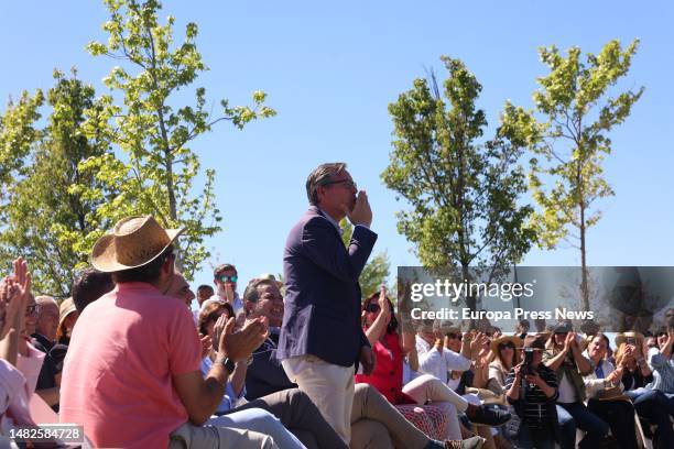 The secretary general of the Partido Popular of Madrid and director of the party's electoral campaign, Alfonso Serrano, blows a kiss to the president...