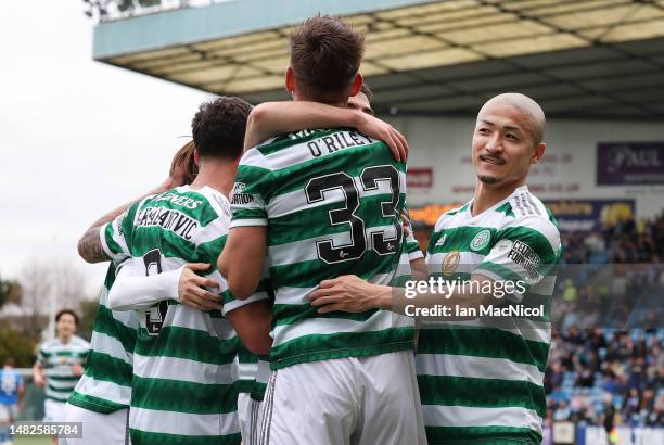 Daizen Maeda of Celtic celebrates after Matt O'Riley scores his team's third goal during the Cinch Scottish Premiership match between Kilmarnock FC...