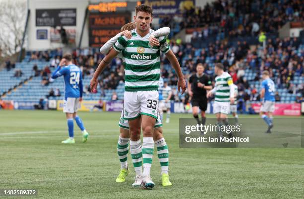 Matt O'Riley of Celtic celebrates after he scores his team's fourth goal during the Cinch Scottish Premiership match between Kilmarnock FC and Celtic...