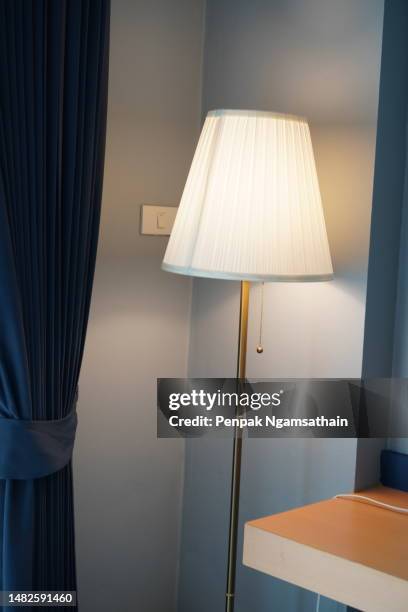 floor lamp curtain wooden table - standing lamp stock pictures, royalty-free photos & images