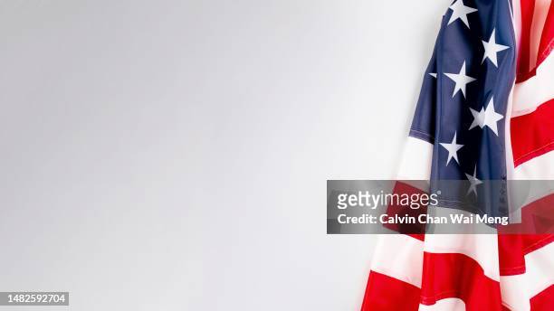 american flag on white background - us flagge stock-fotos und bilder