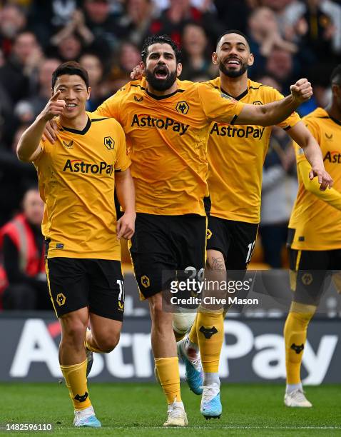 Hwang Hee-Chan of Wolverhampton Wanderers celebrates with teammate Diego Costa after scoring the team's second goal during the Premier League match...