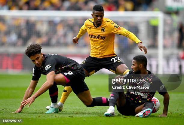 Nelson Semedo of Wolverhampton Wanderers takes on the Brentford defence during the Premier League match between Wolverhampton Wanderers and Brentford...