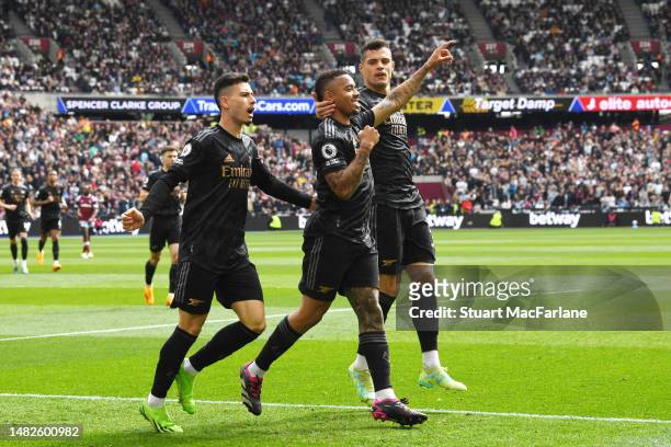 Gabriel Jesus of Arsenal celebrates with teammates Gabriel Martinelli and Granit Xhaka after scoring the team's first goal during the Premier League...