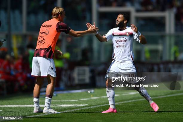 Tonny Vilhena of Salernitana celebrates with teammate Erik Botheim after scoring the team's first goal during the Serie A match between Torino FC and...