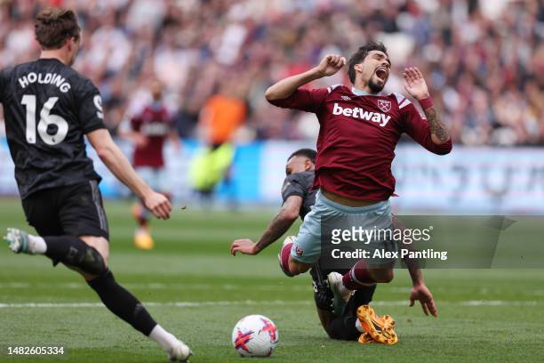 Lucas Paqueta of West Ham United is fouled by Gabriel of Arsenal leading to a penalty during the Premier League match between West Ham United and...