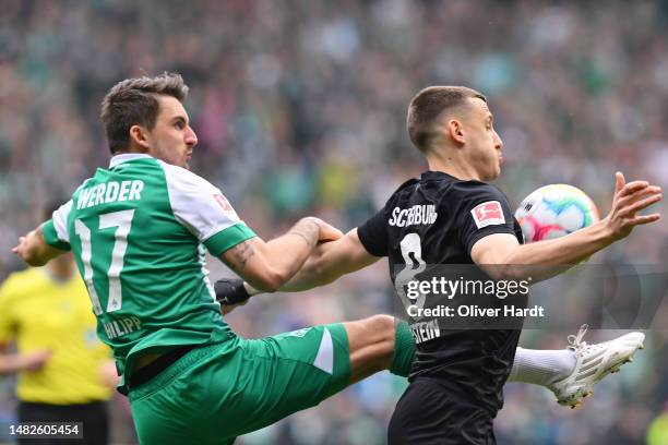 Maximilian Philipp of SV Werder Bremen and Maximilian Eggestein of Sport-Club Freiburg battle for the ball during the Bundesliga match between SV...