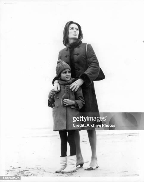 Anouk Aimée with child in a scene from the film 'A Man And A Woman', 1966.