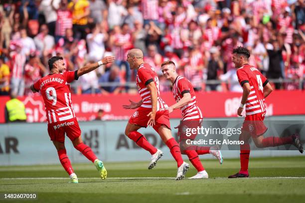 Oriol Romeu of Girona FC celebrates with teammates after scoring the team's second goal during the LaLiga Santander match between Girona FC and Elche...