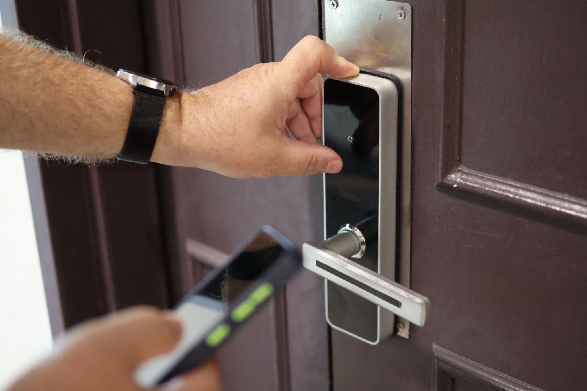 Man opens door to hotel room Man opens door to hotel room