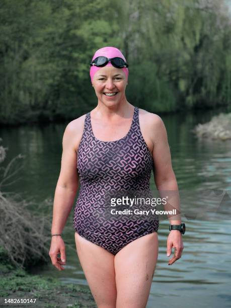 portrait of a female open water swimmer - swimming cap stock pictures, royalty-free photos & images