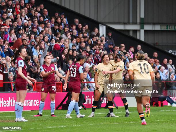 Sam Kerr of Chelsea celebrates with teammate Melanie Leupolz after scoring the team's first goal during the Vitality Women's FA Cup Semi Final match...