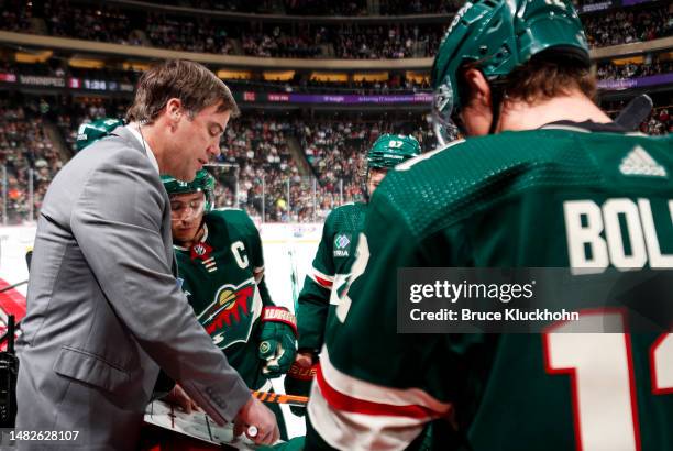 Assistant Coach of the Minnesota Wild Darby Hendrickson addresses the team in the third period of the game against the Winnipeg Jets at Xcel Energy...