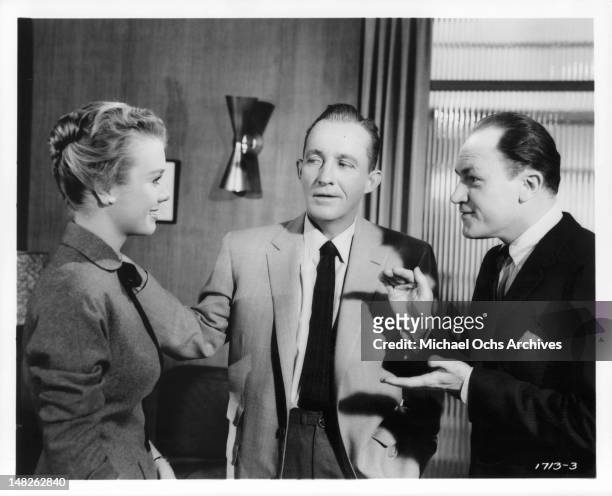 Bing Crosby is introduced to Inger Stevens by EG Marshall in a scene from the film 'Man On Fire', 1957.