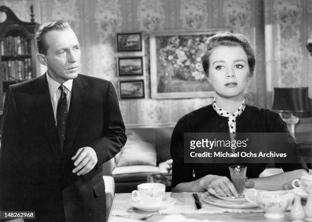 Bing Crosby looking over at Inger Stevens in a scene from the film 'Man On Fire', 1957.