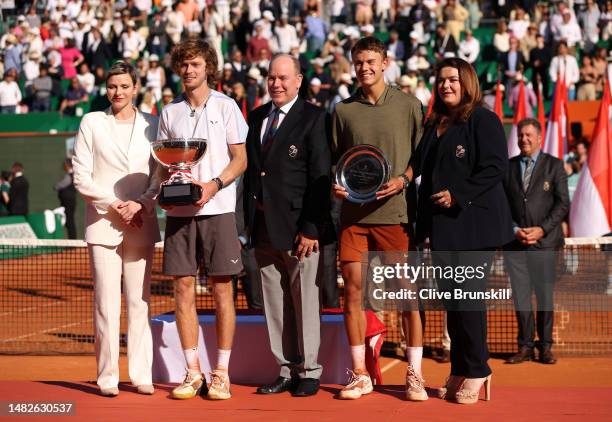 Princess Charlene, Andrey Rublev holding the winners trophy, Prince Albert II, Holger Rune of Denmark and Melanie-Antoinette De Massy, President of...