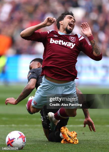 Lucas Paqueta of West Ham United is fouled by Gabriel of Arsenal leading to a penalty during the Premier League match between West Ham United and...