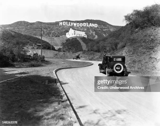 Sign advertises the opening of the Hollywoodland housing development in the hills on Mulholland Drive overlooking Los Angeles, Hollywood, Los...