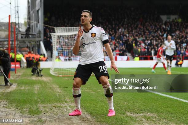 Diogo Dalot of Manchester United celebrates after scoring the team's second goal during the Premier League match between Nottingham Forest and...