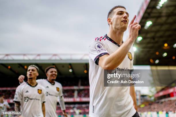 Diogo Dalot of Manchester United celebrates after scoring their sides second goal during the Premier League match between Nottingham Forest and...