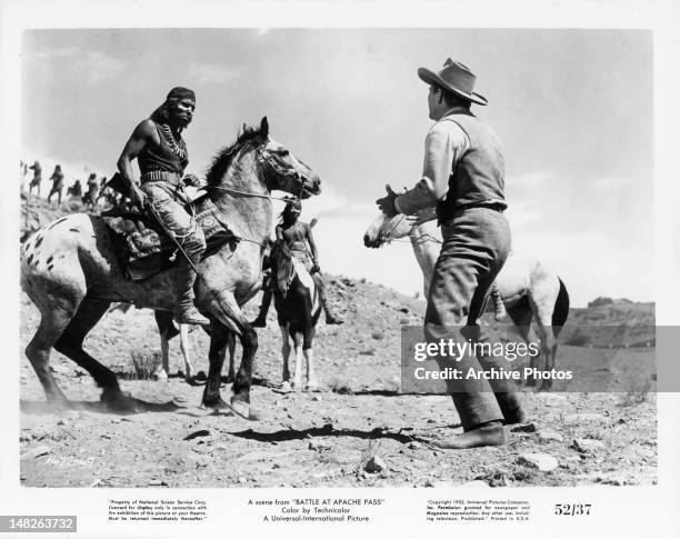 Indians surrounding man in a scene from the film 'The Battle At Apache Pass', 1952.