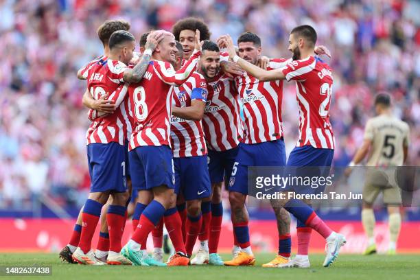 Antoine Griezmann of Atletico Madrid celebrates with teammates after scoring the team's second goal during the LaLiga Santander match between...