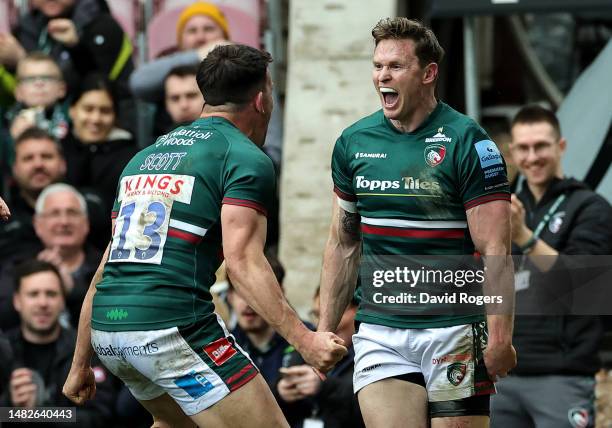 Chris Ashton of Leicester Tigers celebrates with team mate Matt Scott after scoring his 100th try of his career during the Gallagher Premiership...