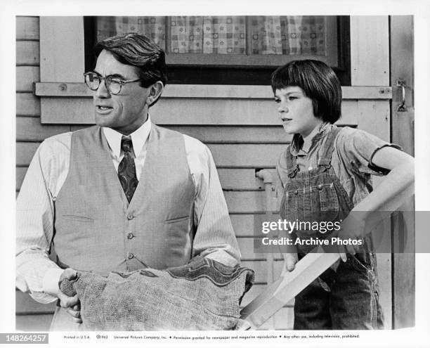 Gregory Peck standing next to Mary Badham in a scene from the film 'To Kill A Mockingbird', 1962.