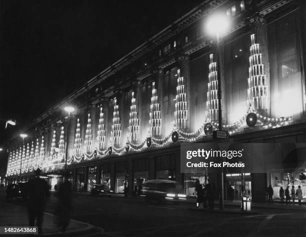 The Christmas lights on the facade of Selfridges department store on Oxford Street, in the West End of London, England, 25th November 1970.