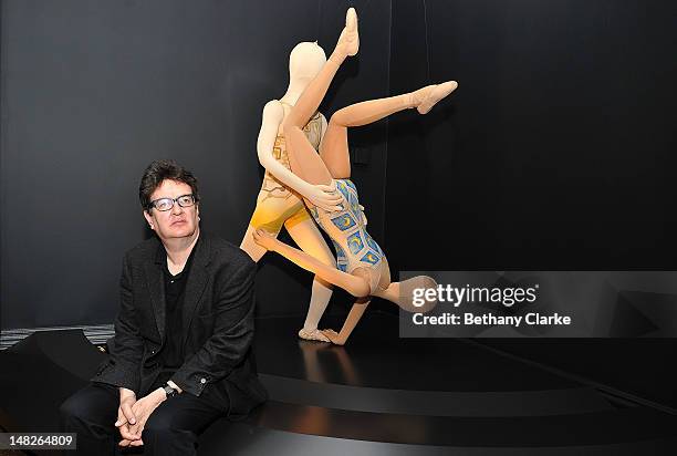 Contemporary artist Mark Wallinger, poses in front of some of his costume designes on July 9, 2012 in London, England. The Metamorphosis Exhibition...