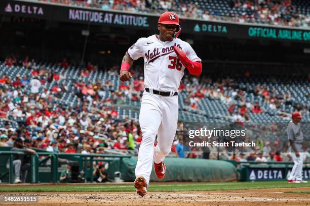 Stone Garrett of the Washington Nationals scores a run against the Cleveland Guardians during the second inning at Nationals Park on April 16, 2023...