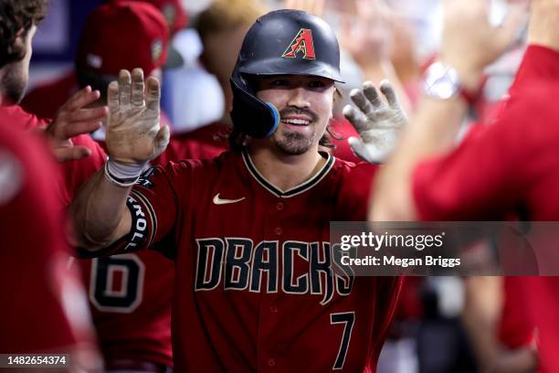 Corbin Carroll of the Arizona Diamondbacks celebrates after hitting a home run against the Miami Marlins during the sixth inning at loanDepot park on...