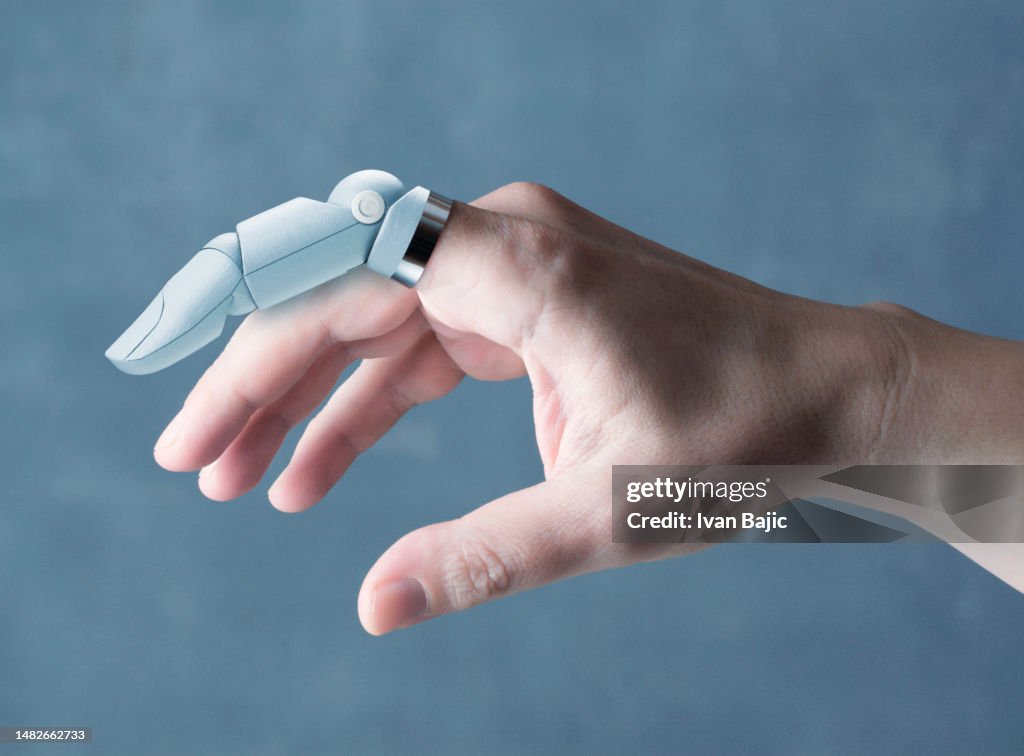 Hand with robotic finger