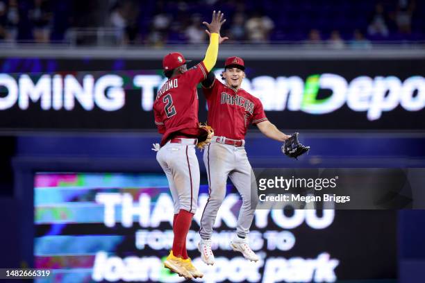 Geraldo Perdomo and Alek Thomas of the Arizona Diamondbacks celebrate after defeating the Miami Marlins at loanDepot park on April 16, 2023 in Miami,...
