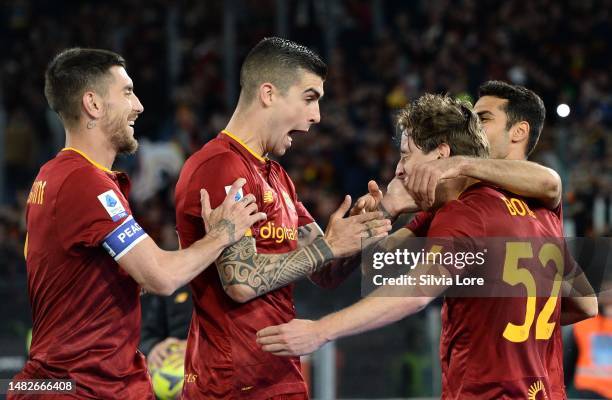 Edoardo Bove of AS Roma celebrates with teammate Gianluca Mancini and Lorenzo Pellegrini after scoring goal 1-0 during the Serie A match between AS...