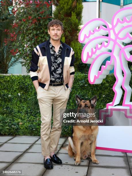 John Reardon and German Shepherd Dog Diesel vom Burgimwald, aka Rex, attends the 6th Canneseries International Festival : Day Three on April 16, 2023...