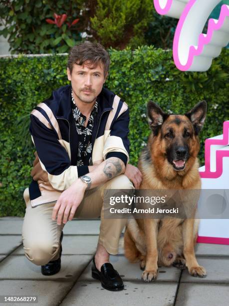 John Reardon and German Shepherd Dog Diesel vom Burgimwald, aka Rex, attends the 6th Canneseries International Festival : Day Three on April 16, 2023...