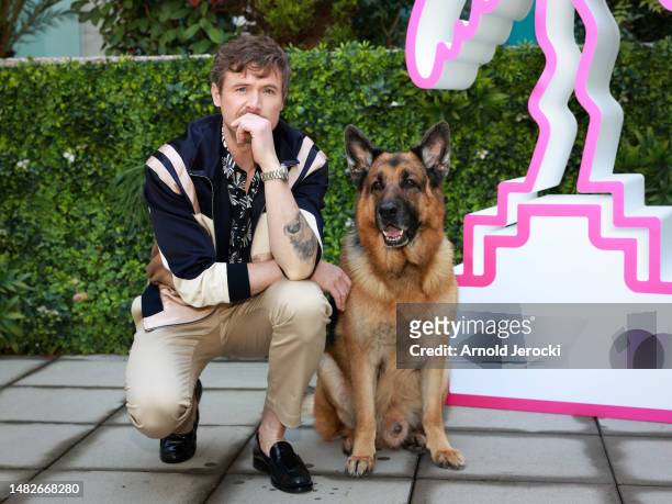 John Reardon and German Shepherd Dog Diesel vom Burgimwald, aka Rex, attends the 6th Canneseries International Festival : Day Three on April 16, 2023...