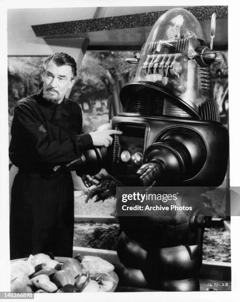 Walter Pidgeon with robot in a scene from the film 'Forbidden Planet', 1956.