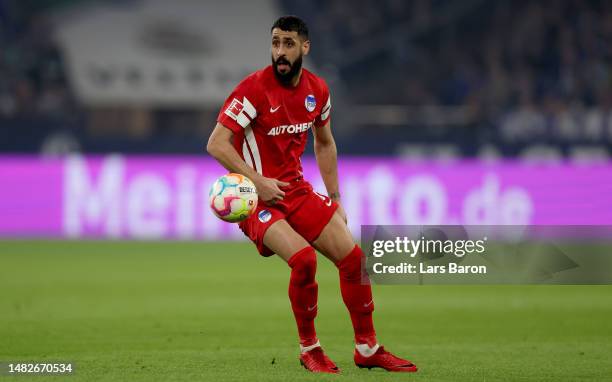 Tolga Cigerci of Hertha BSC runs with the ball during the Bundesliga match between FC Schalke 04 and Hertha BSC at Veltins-Arena on April 14, 2023 in...