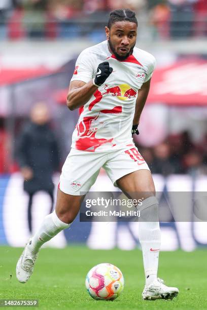 Christopher Nkunku of RB Leipzig controls the ball during the Bundesliga match between RB Leipzig and FC Augsburg at Red Bull Arena on April 15, 2023...