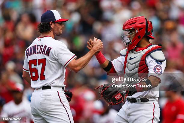 Kyle Finnegan and Keibert Ruiz of the Washington Nationals celebrates after the game against the Cleveland Guardians at Nationals Park on April 16,...