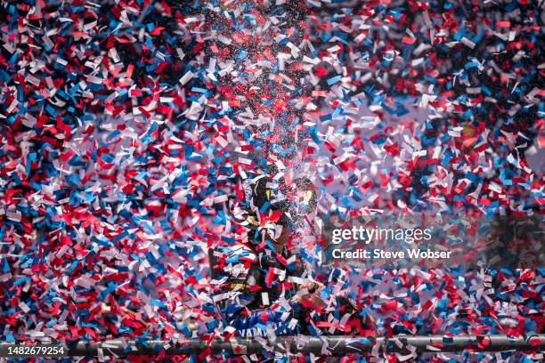 Fabio Quartararo of France and Monster Energy Yamaha MotoGP celebrates with Prosecco during the confetti rain after the Race of the MotoGP Red Bull...