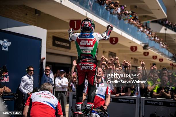 Luca Marini of Italy and Mooney VR46 Racing Team stands on his bike at parc ferme after he won the race during the Race of the MotoGP Red Bull Grand...